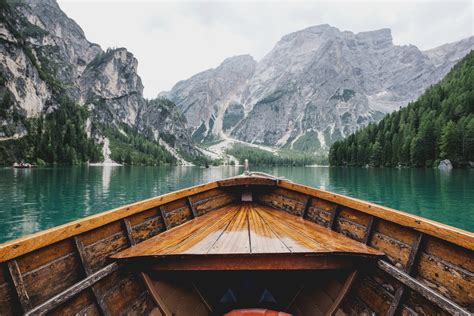 View From A Boat On The Emerald Green Lago Di Braies And The Nearby