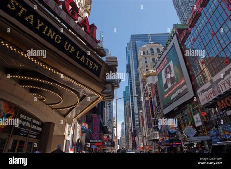Times Square Manhatten Nyc In Daytime Showing Signs And Attractions
