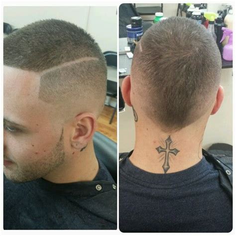 Even if the bald fade haircut doesn't ring a bell, chances are you have come across this trend in your everyday life. Mohawk bald fade with design | Bald fade, Ear tattoo ...