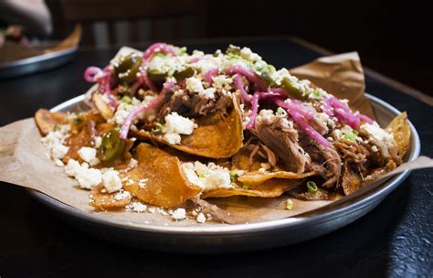 The Most Epic Nacho Plates In Every State Pork Nachos Pulled Pork Nachos Kettle Cooked Chips