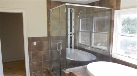frameless shower enclosure notched for tub deck with header and 90 degree return panel 6