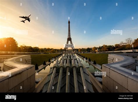Airplane Flying Over Eiffel Tower In Morning Paris France Eiffel