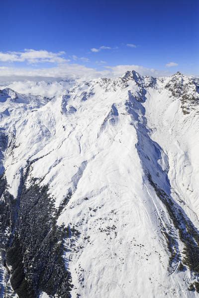 Aerial View Of The Alpine Lago Di Lei Surrounded By Snow
