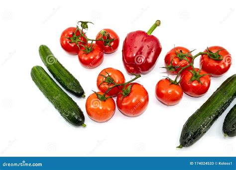 Large Green Cucumbers One Red Bell Pepper Red Tomatoes On A Green