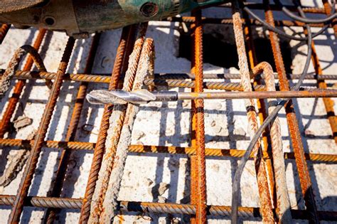 Concrete Drill And Grinder Was Putted On The Quadratic Rusted Armature