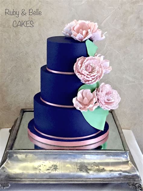 Navy Blue Wedding Cake With Pale Pink Flowers Created By Ruby And Belle