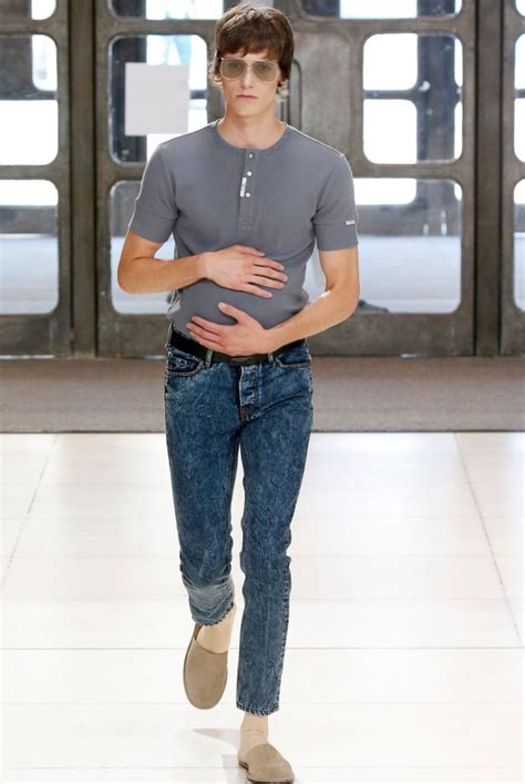 a bunch of male models walked the runway with fake pregnant bellies