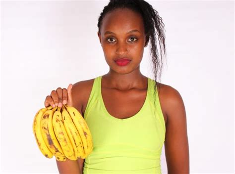 Beautiful Woman Holding Ripe Banana Bunch High Quality Free Stock Images