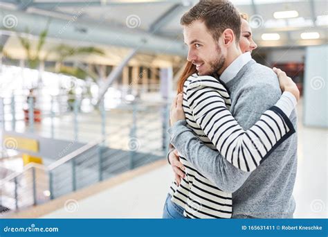 Couple In Long Distance Hugging Each Other At The Airport Stock Image Image Of Terminal