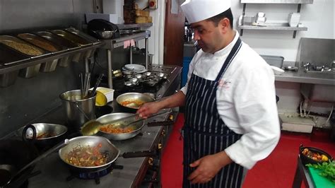 Busy Chef At Work Action Inside An Indian Restaurant Kitchen At