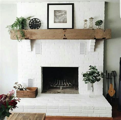 Brick Fireplace Painted White With A Cedar Mantle White Brick