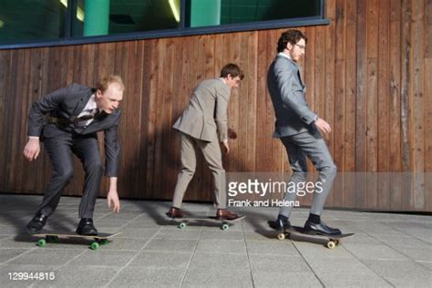 Businessmen Riding Skateboards High Res Stock Photo Getty Images