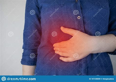A Woman Grabs His Right Side Under The Ribs Pain In The Liver Pain