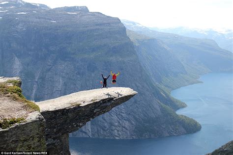 Thrill Seekers Jump On Trolltunga Clifftop 2300ft Above Norwegian