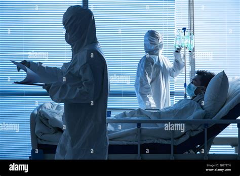 Doctors Treating Patients In The Ward Stock Photo Alamy