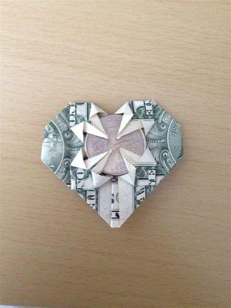 This origami star is often attributed to trang chung because she was the first person to make the star using money; How to Make an Origami Dollar Heart That Holds a Quarter ...