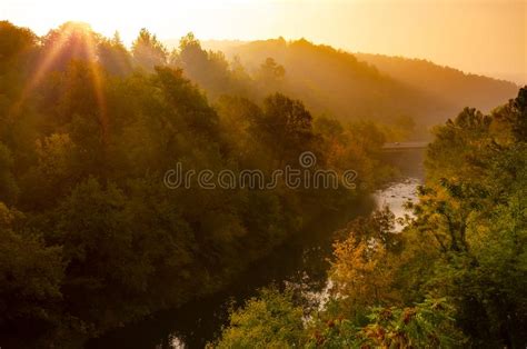 Magical Sunrise Over Deep Foggy Autumn Forest Along A River First Rays