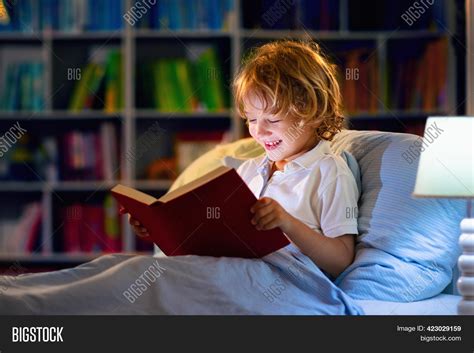 Child Reading Book Bed Image And Photo Free Trial Bigstock