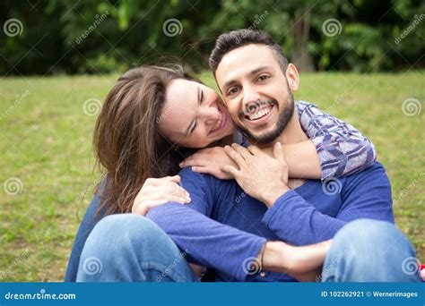 Young Beautiful Couple Sitting Outside In Park Stock Image Image Of
