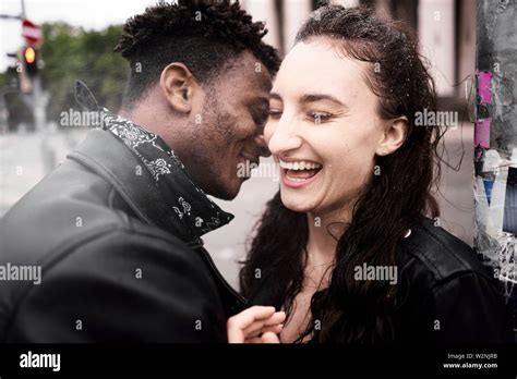 Happy Mixed Race Couple At Street Rainy Weather In Munich Germany