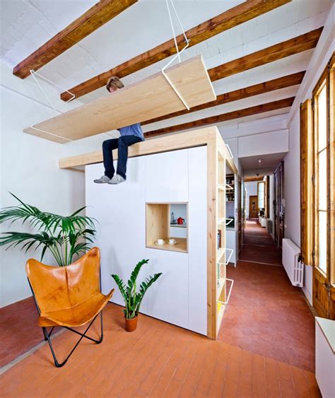 The best way to attach your hanger to the ceiling is by using a spring toggle hook set. Wooden Desk is Hanging From the Ceiling in this Apartment ...
