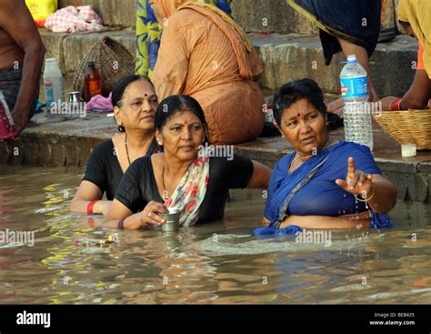 Woman Take Morning Bath Inside Of River Ganges In Varanasi India Stock