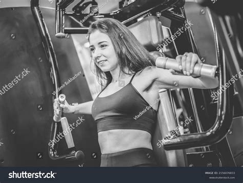 Young Fit Woman Trains Pectoral Muscles Stock Photo 2156076833