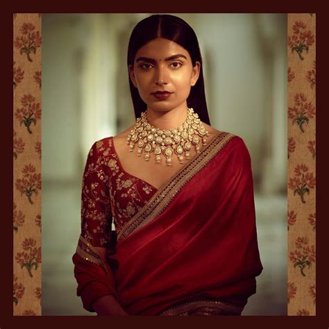 A Classic Sabyasachi Silk Saree In Red With Hand Embroidered Border And