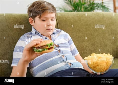 Overweight Child Eating Junk Food Hi Res Stock Photography And Images
