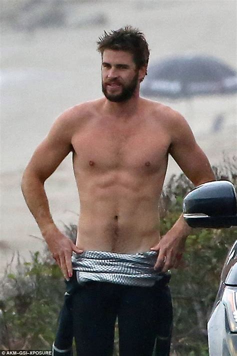 Liam Hemsworth Flaunts His Ripped Six Pack While Surfing In California Daily Mail Online