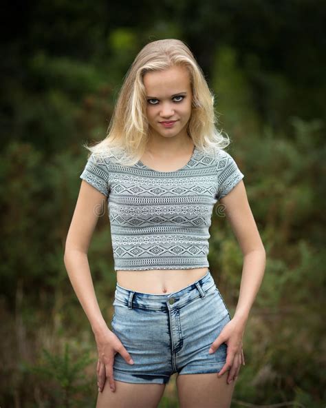 Beautiful Blond Teen Showing Belly Button Stock Photo