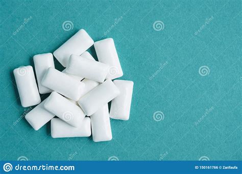 Top View Of Heap Of Chewing Gums On Blue Background Copy Space Stock