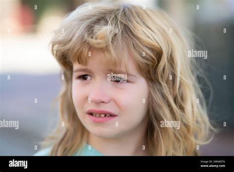 Portrait Of A Crying Child With Tears Close Up The Kid Is Crying