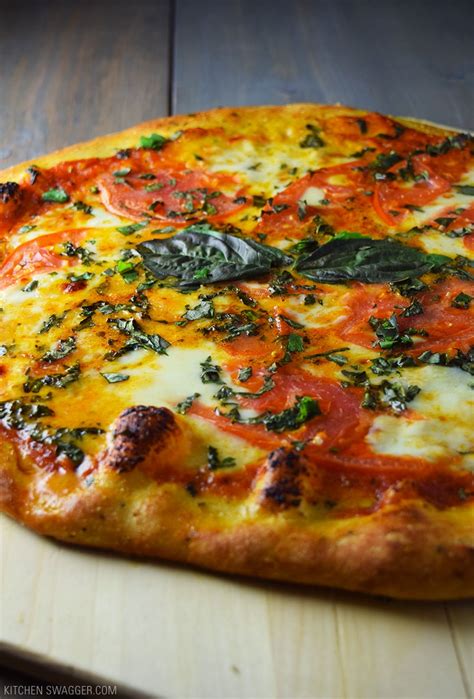Cut each pizza into 8 slices. Classic Margherita Pizza Recipe | Kitchen Swagger