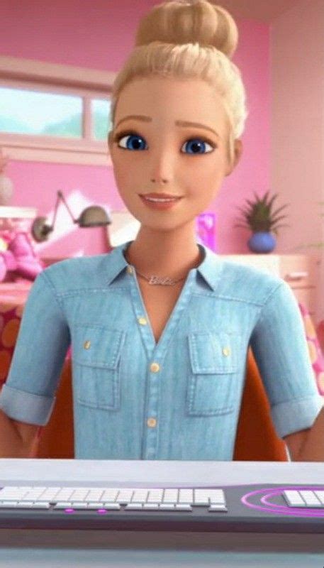 a barbie doll standing in front of a computer screen with her hands on the keyboard