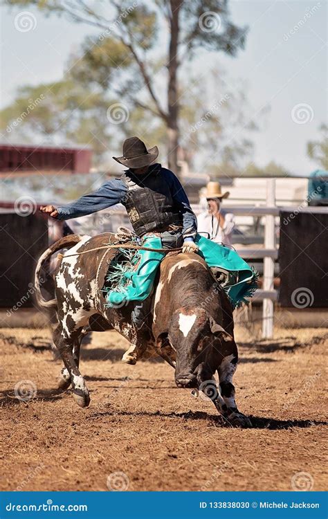 Cowboy Riding A Bucking Bull In A Rodeo Editorial Image Image Of