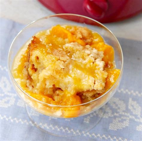 Fresh peaches are bathed in brown sugar, almond extract, peach juice and butter before being stirred together with a yellow cake mix. Easy 3 Ingredient Crock Pot Peach Cobbler with Cake Mix