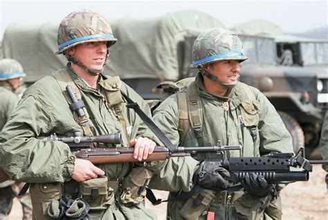 32nd Infantry Armed With An M 16a1 With M 203 And An M 21 Rifle Team