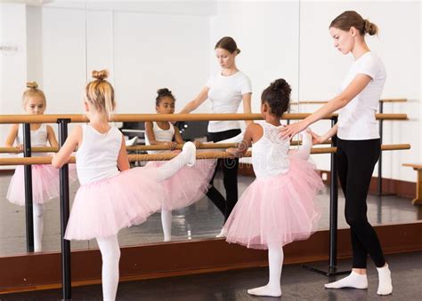 Teacher Helping Her Little Ballerinas Stock Photo Image Of Ballerina