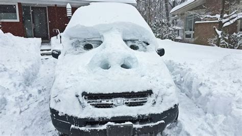 Sculpted Snow Face On Car Brings Smiles To Those Slammed