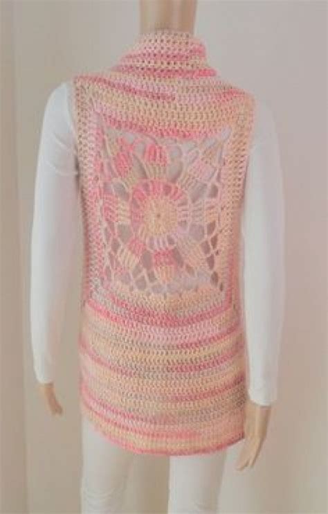 A Mannequin Wearing A Pink Crocheted Vest