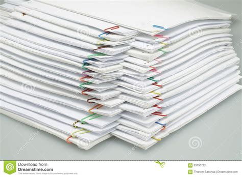 Colorful Paper Clip With Pile Of Paper Reports Arranged On Table Stock