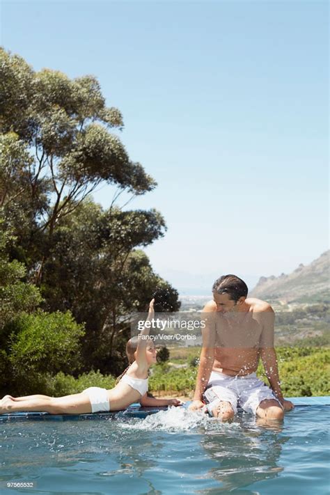 Father And Daughter By A Pool Bildbanksbilder Getty Images