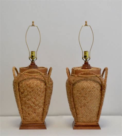 Nautical lamps work well on a small table in the foyer to bring them up to a higher level for viewing. Pair of Woven Rattan Basket Table Lamps at 1stdibs