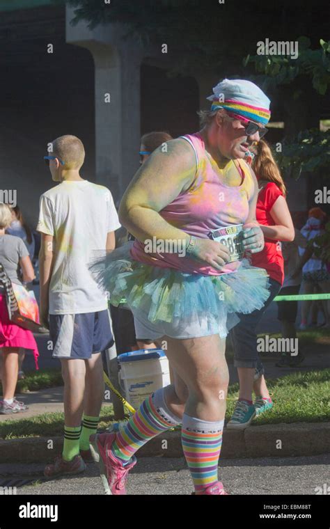 Woman Runners In Tutus And Clothing Splattered With Colorful Dye Race In The The Happy Asheville
