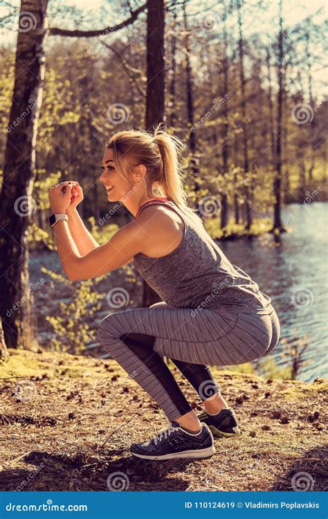 Sporty Blond Female Doing Squats Stock Image Image Of Person