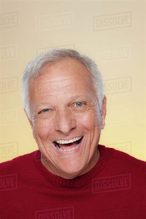 Studio Shot Of Laughing Senior Man Stock Photo Dissolve