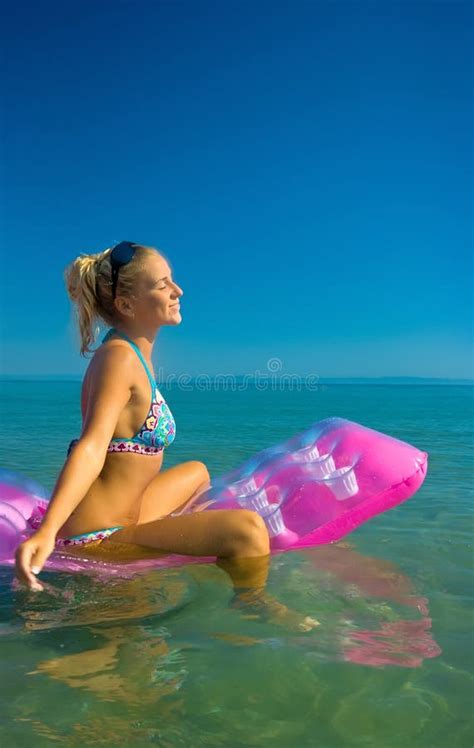 Blonde Girl On Inflatable Raft Stock Image Image Of Floating Bikini
