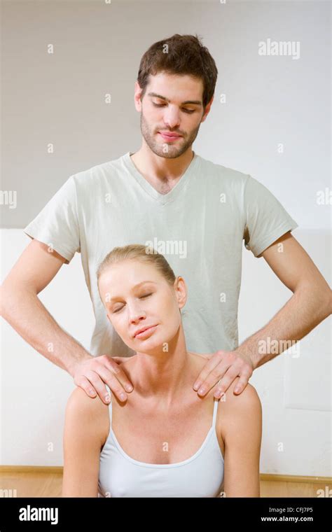 Man Massaging Woman S Shoulders Stock Photo Alamy