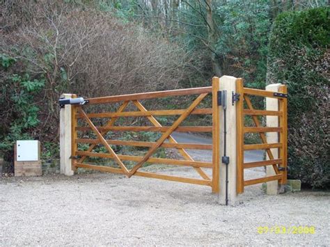 Browse 5,846 photos of driveway gate ideas. Wooden automated driveway gate with side pedestrian gate ...